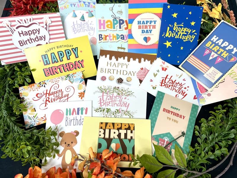 A spread of birthday greeting cards available at the counter.
